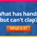 What has hands, but can't clap?