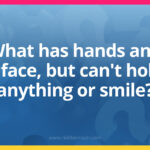 What has hands and a face, but can't hold anything or smile?