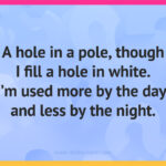 A hole in a pole, though I fill a hole in white. I'm used more by the day, and less by the night.