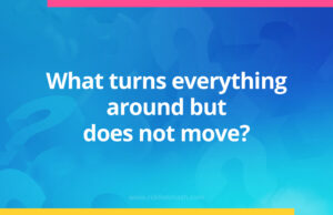 What turns everything around but does not move?